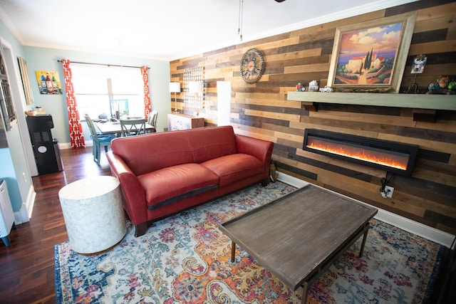 living room featuring dark wood-type flooring, crown molding, and wooden walls