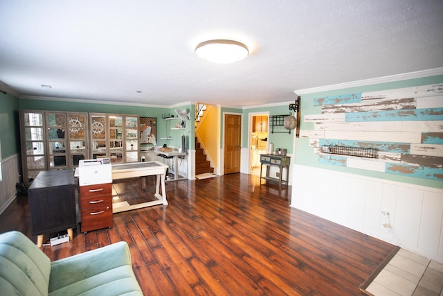 office area with dark wood-type flooring and ornamental molding