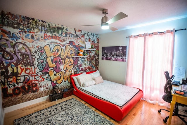 bedroom featuring ceiling fan and wood-type flooring