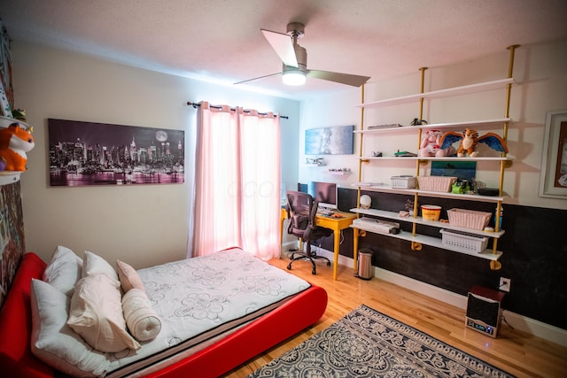 bedroom featuring ceiling fan and hardwood / wood-style floors