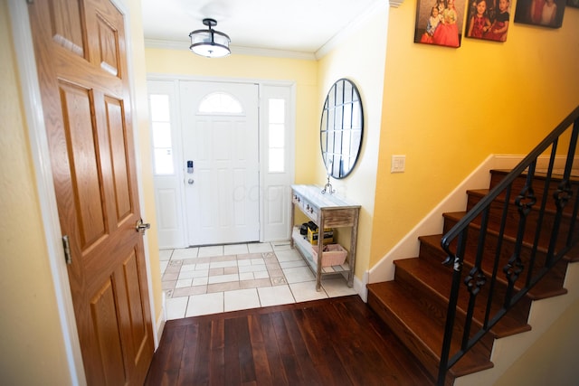 entrance foyer featuring light hardwood / wood-style flooring and ornamental molding