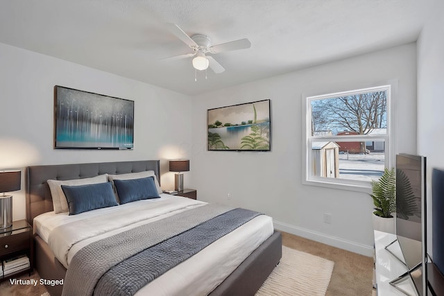 carpeted bedroom with ceiling fan