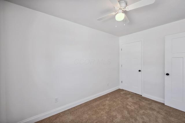 unfurnished bedroom with ceiling fan and carpet flooring