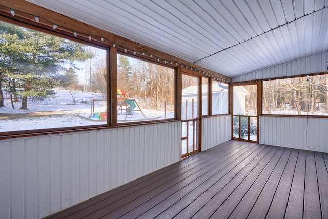 unfurnished sunroom with vaulted ceiling and a wealth of natural light