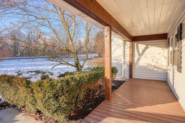 view of snow covered deck