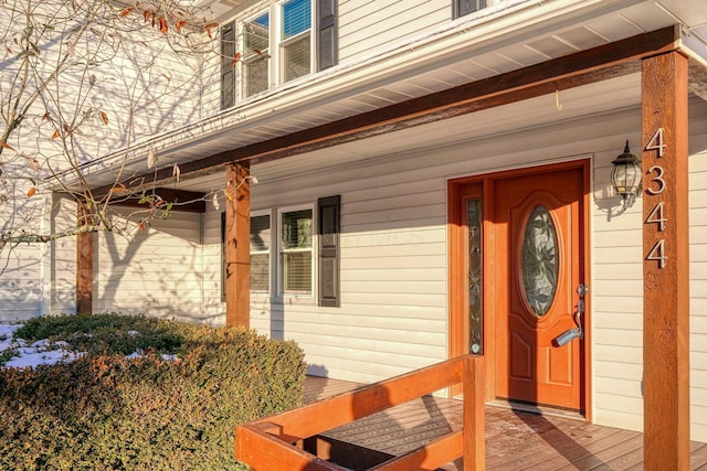 view of exterior entry featuring a porch