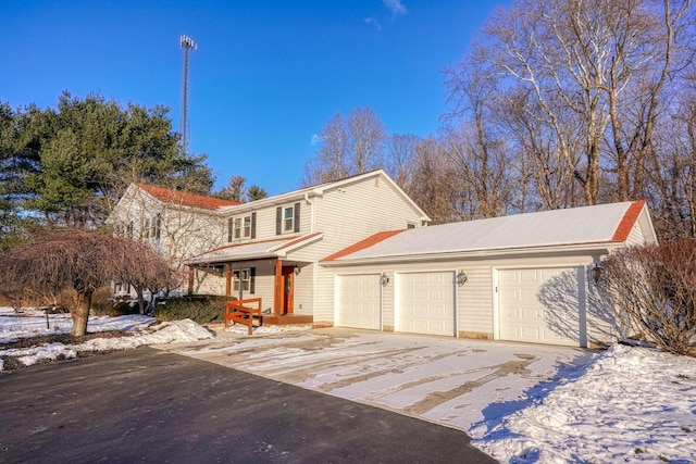 front of property with covered porch and a garage