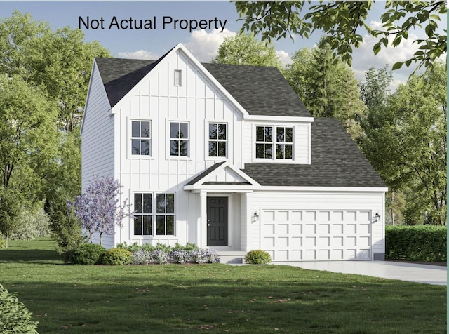 view of front of house with a front lawn and a garage