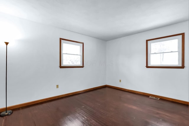 spare room featuring hardwood / wood-style flooring