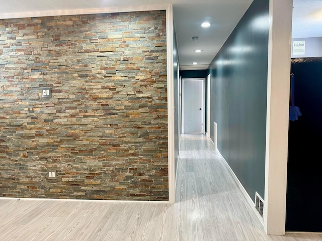 hallway with recessed lighting, visible vents, baseboards, and wood finished floors