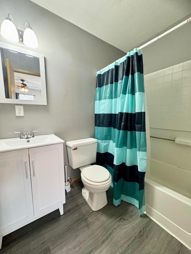 bathroom featuring shower / bath combo, a textured ceiling, toilet, and wood finished floors