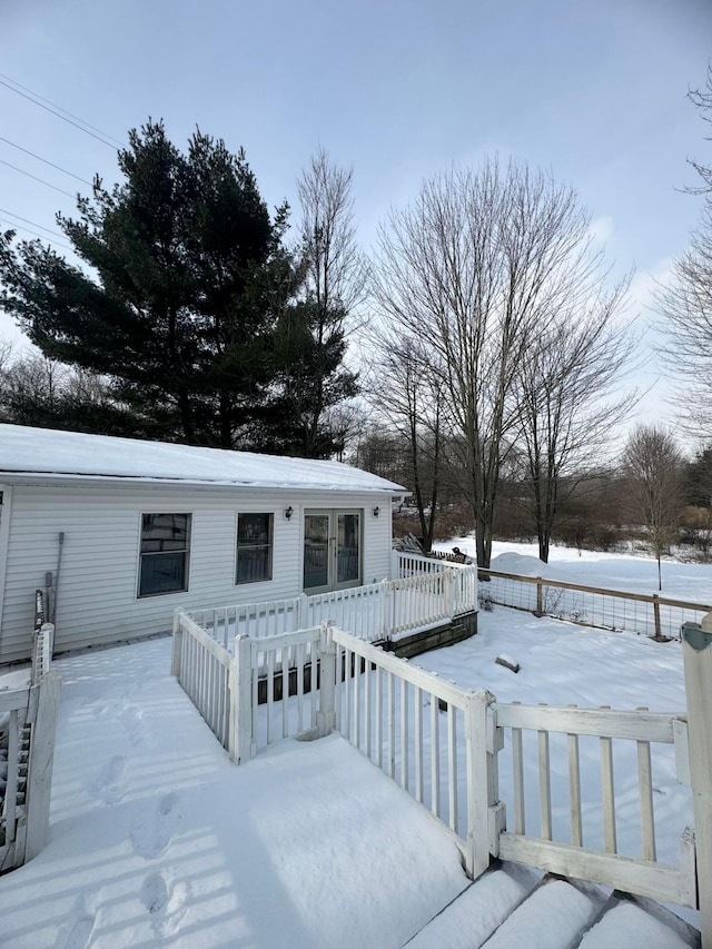 view of snow covered deck