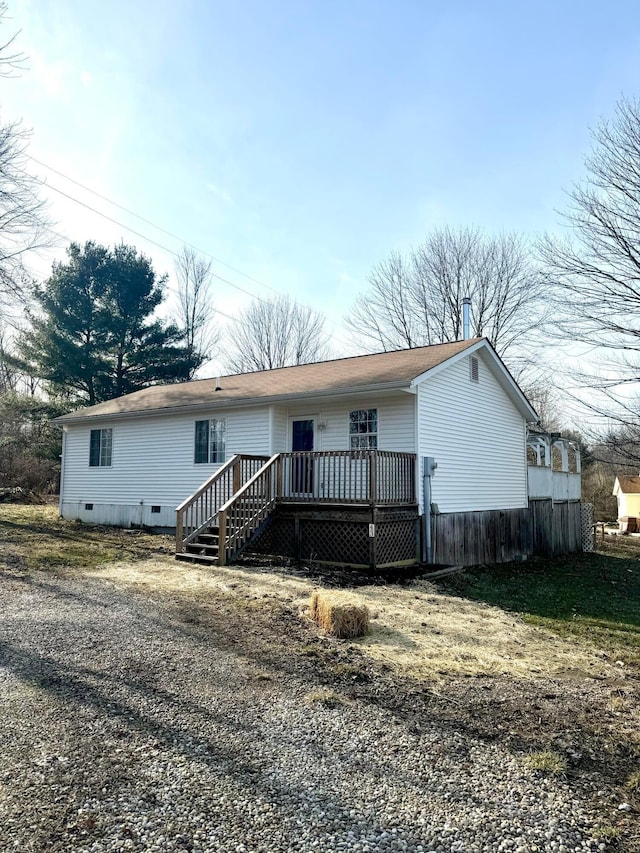 view of front of house featuring crawl space and a wooden deck