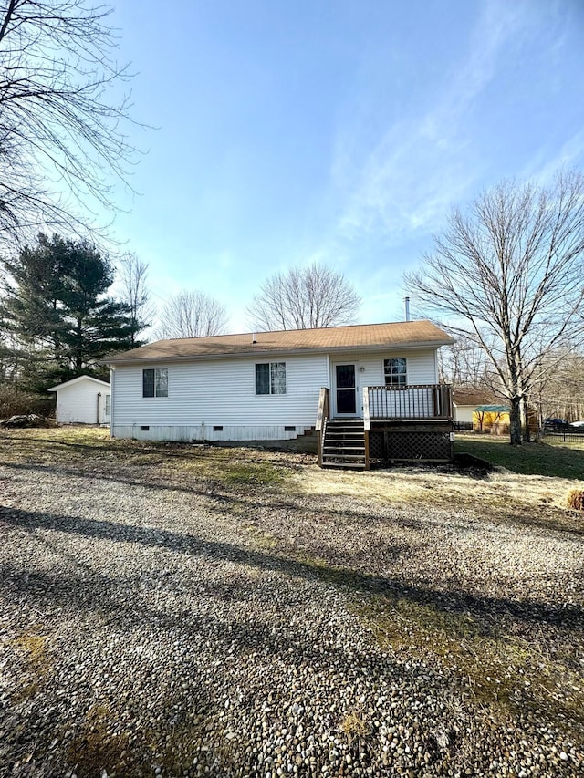 view of front of house featuring crawl space and a wooden deck