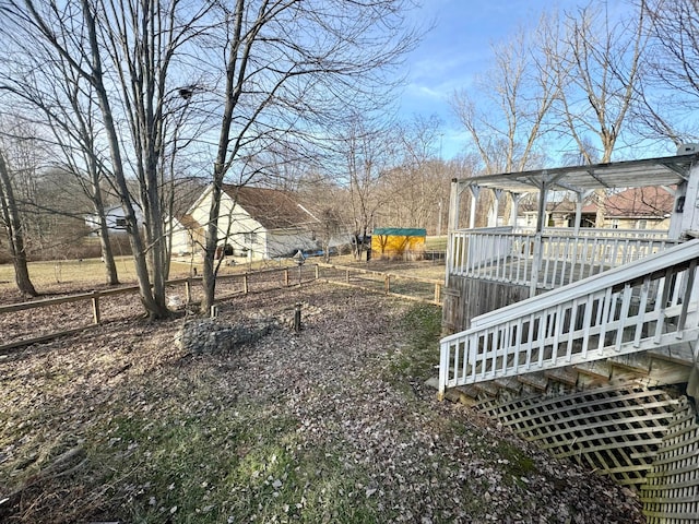 view of yard with a wooden deck and a pergola