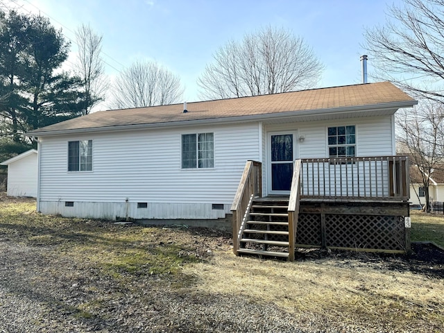 rear view of house featuring crawl space