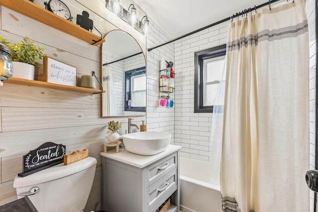 full bathroom featuring vanity, toilet, and shower / bath combo with shower curtain