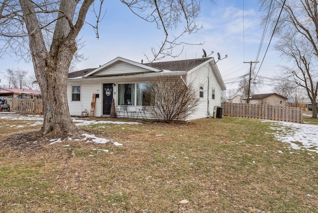 view of front of property featuring central AC and a front lawn