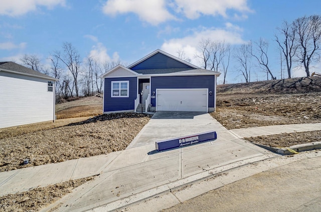 ranch-style home featuring driveway and an attached garage