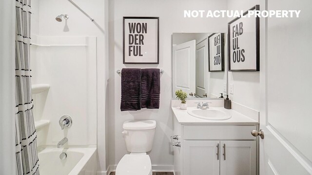 full bathroom featuring vanity, toilet, and washtub / shower combination