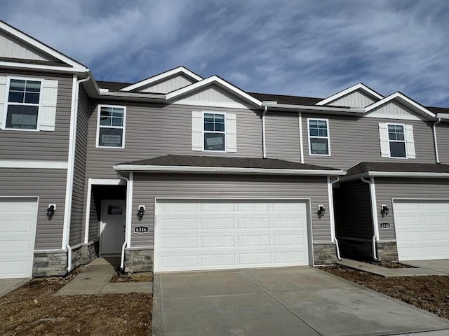 multi unit property featuring a garage