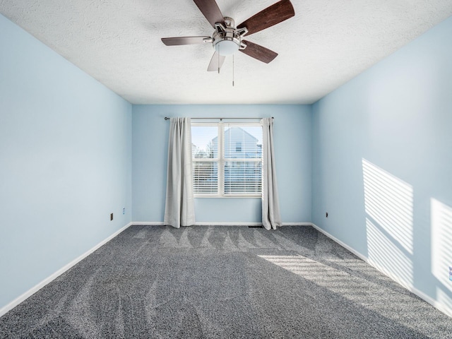 carpeted spare room with ceiling fan and a textured ceiling