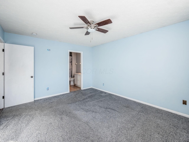 unfurnished bedroom featuring ceiling fan, connected bathroom, and carpet flooring