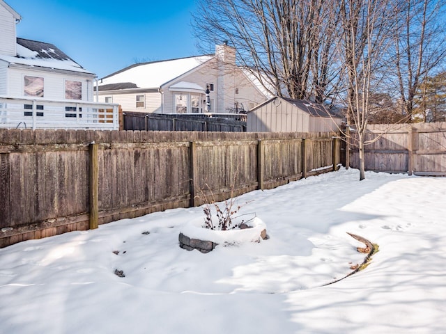 view of yard covered in snow