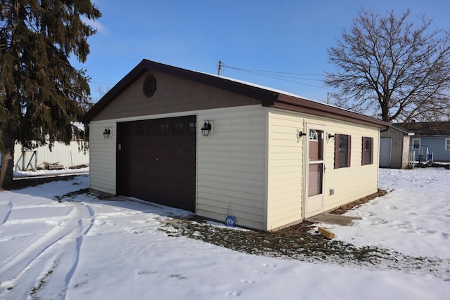 view of snow covered garage