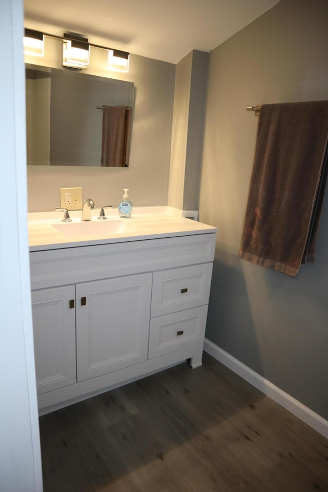 bathroom featuring vanity and hardwood / wood-style floors