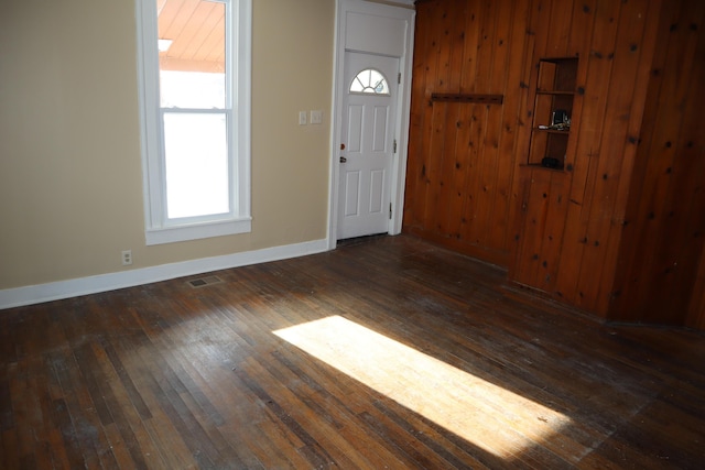 foyer with dark hardwood / wood-style floors