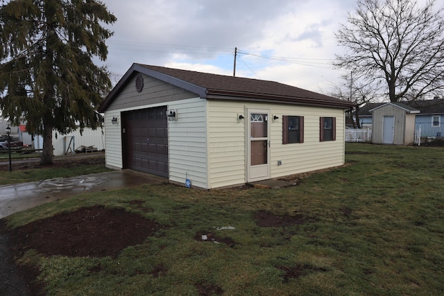 garage with a yard