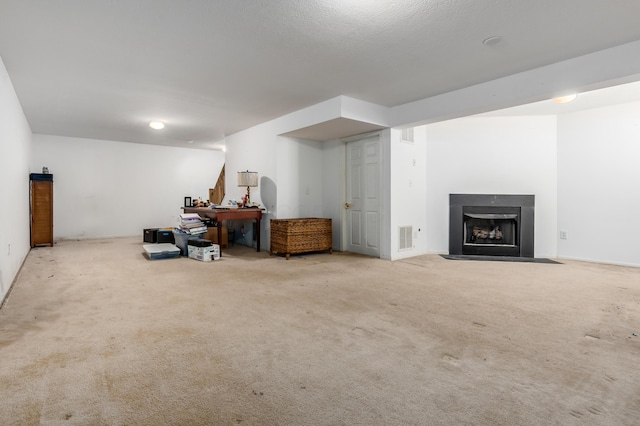 basement featuring light colored carpet