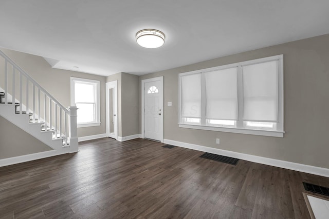 foyer featuring dark wood-type flooring