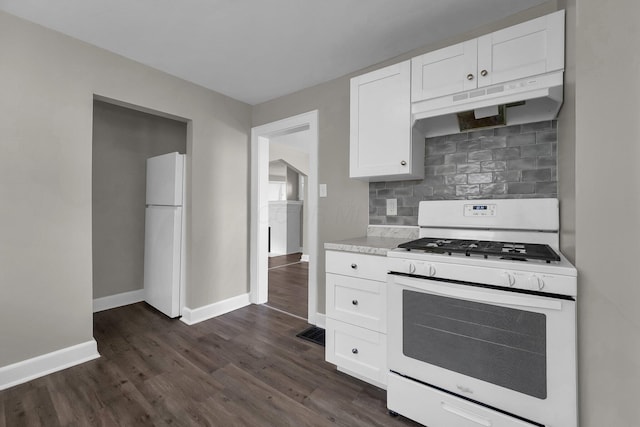 kitchen with backsplash, white appliances, white cabinets, and dark hardwood / wood-style flooring