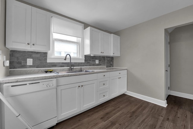 kitchen featuring sink, dishwasher, white cabinets, and decorative backsplash