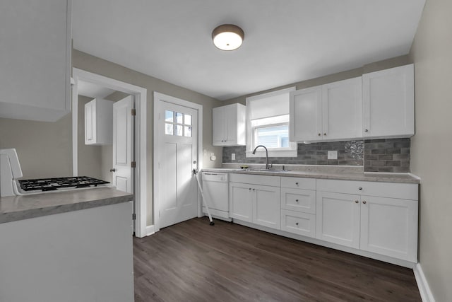 kitchen with backsplash, dark wood-type flooring, white cabinetry, and dishwasher