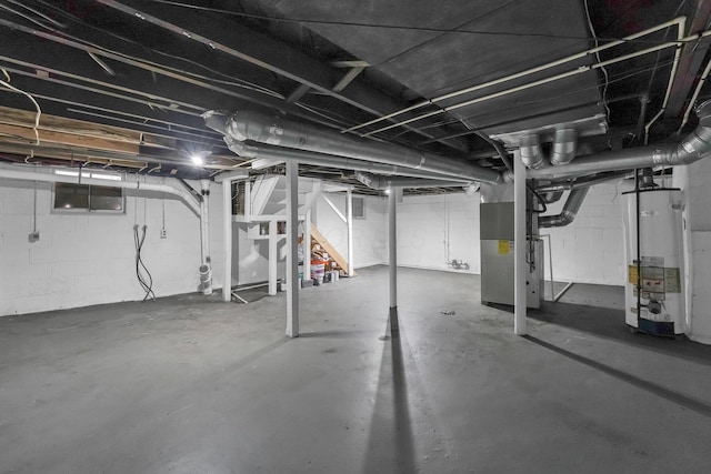 basement with heating unit and water heater