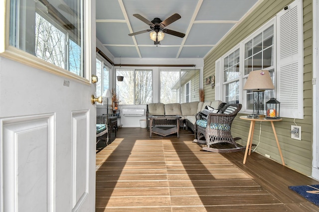 sunroom / solarium with ceiling fan and coffered ceiling