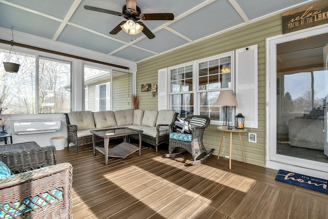 sunroom / solarium featuring ceiling fan and coffered ceiling