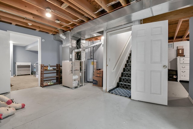 basement featuring heating unit and water heater