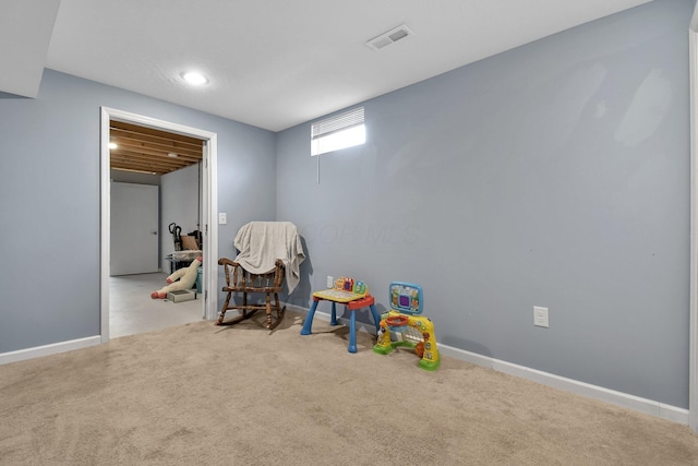 game room with light carpet