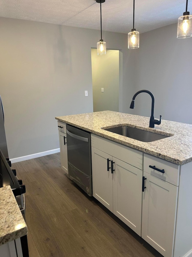 kitchen with decorative light fixtures, sink, white cabinetry, and dishwasher