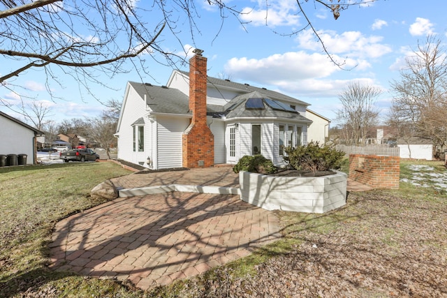 rear view of house with a lawn