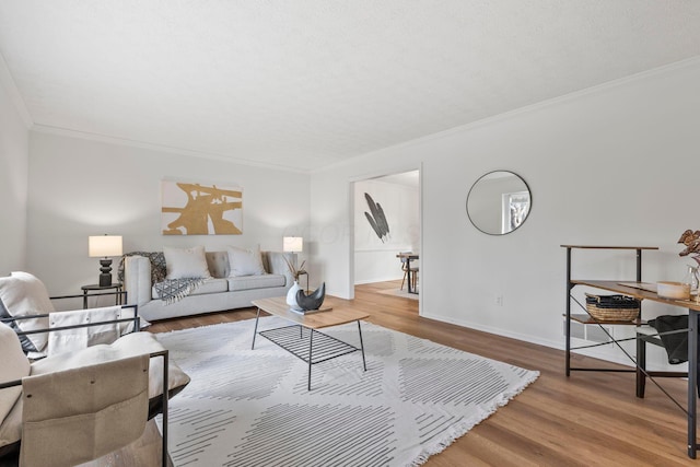 living room featuring crown molding and wood-type flooring