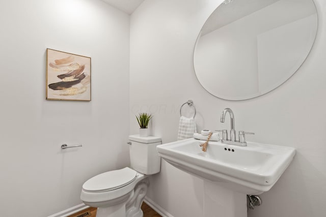 bathroom featuring sink and toilet