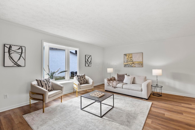 living room featuring hardwood / wood-style floors and a textured ceiling