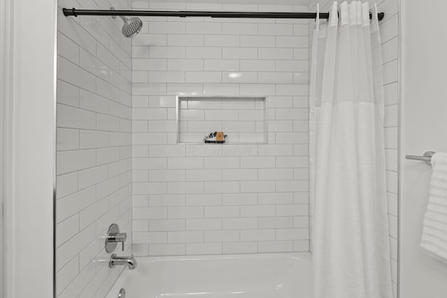 bathroom featuring shower / tub combo with curtain