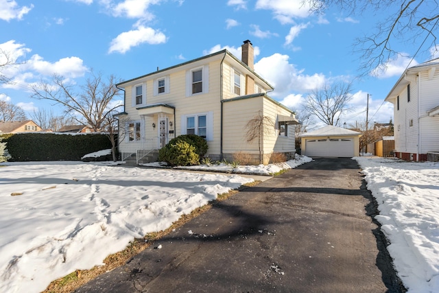 front of property featuring a garage and an outdoor structure