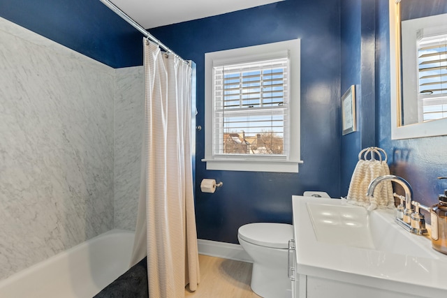 full bathroom with toilet, shower / tub combo, wood-type flooring, and vanity